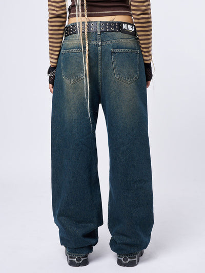 ripped knees baggy jeans in washed blue and loose fit- back view