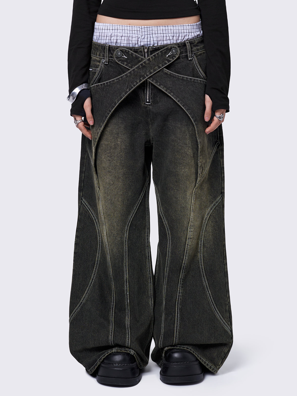 Black washed baggy jeans with green overdye and cross panels and seams details.
