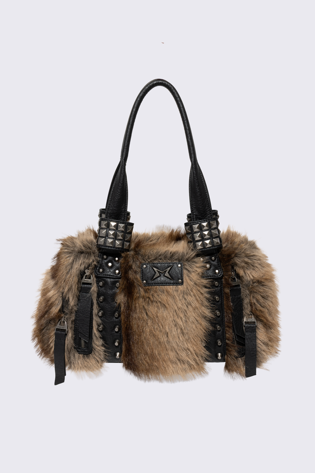 Brown faux fur shoulder bag with black faux leather panels, multiple pockets and pyramid stud hardware.