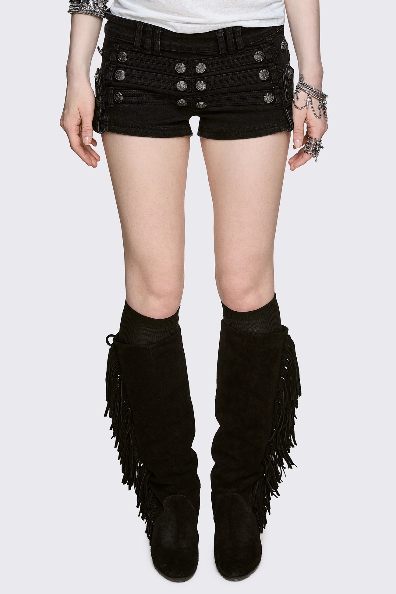 Black washed denim micro shorts with military button detailing and low-rise fit in a grunge style.