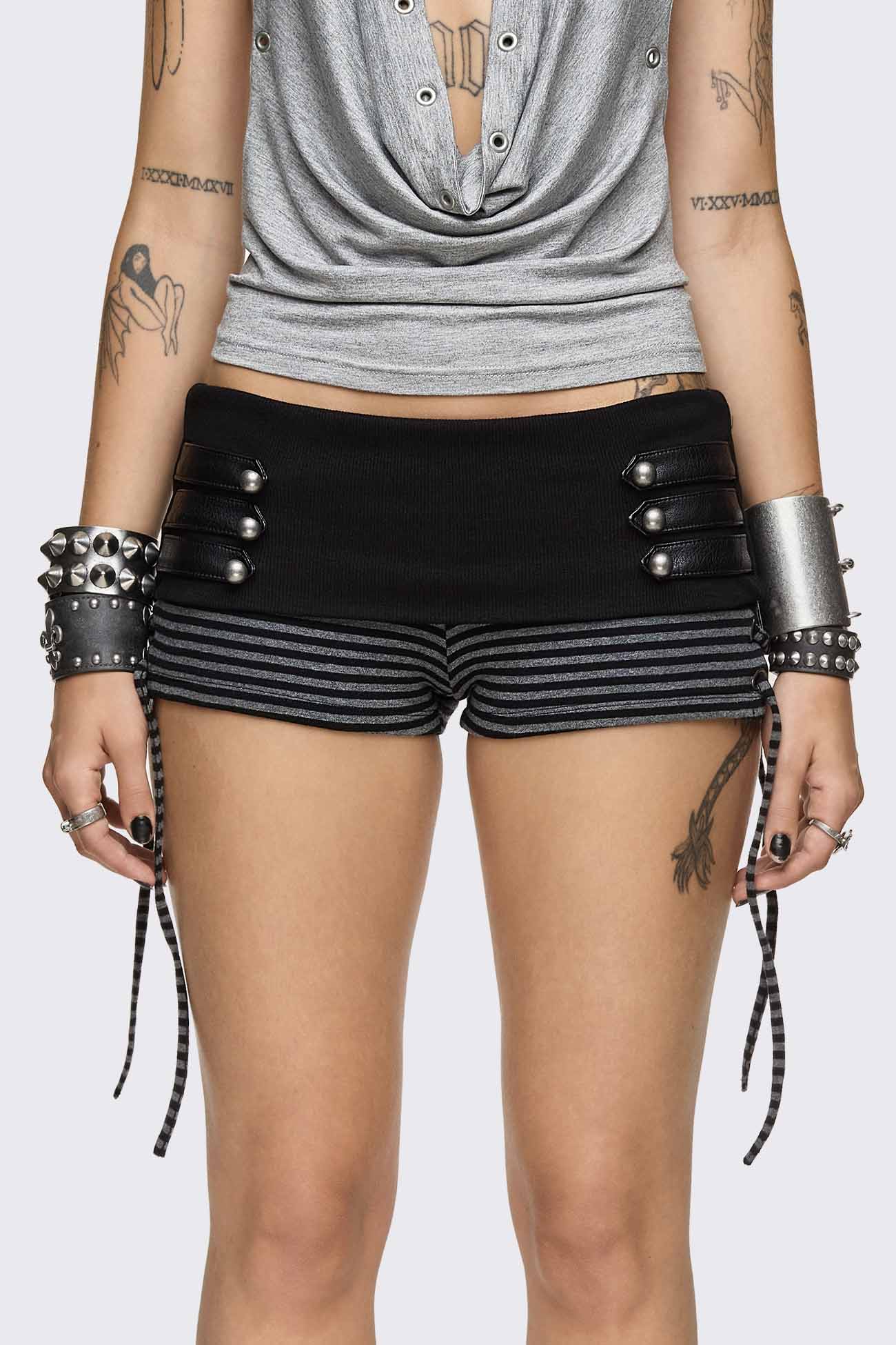 Grey and black striped hot pants with lace-up sides, fold-over waistband and faux leather strap details.
