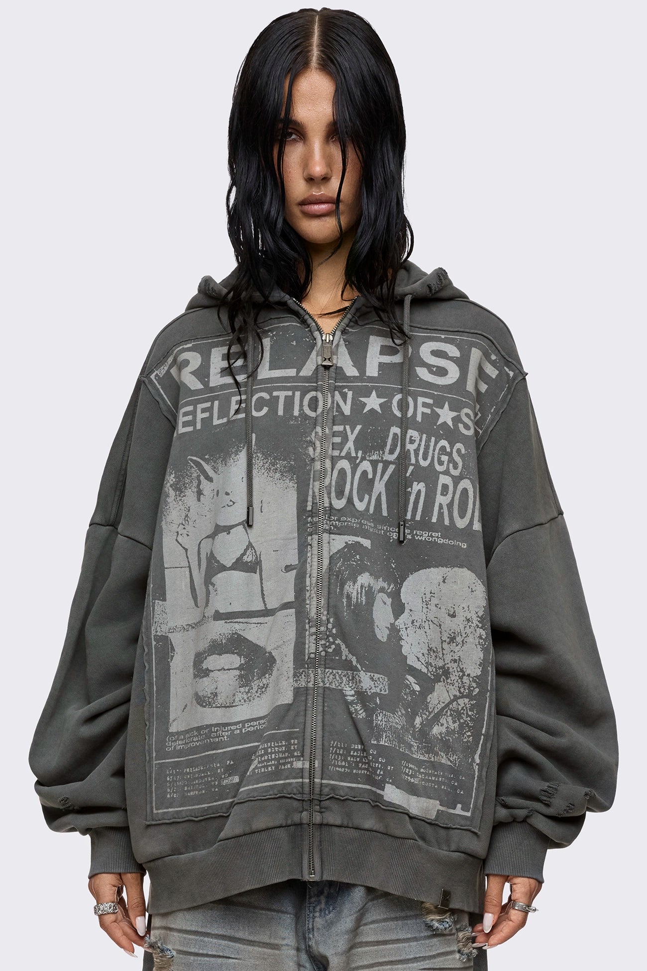 Grey washed zip up hoodie with Relapse graphic print, distressed details and oversized fit on model.