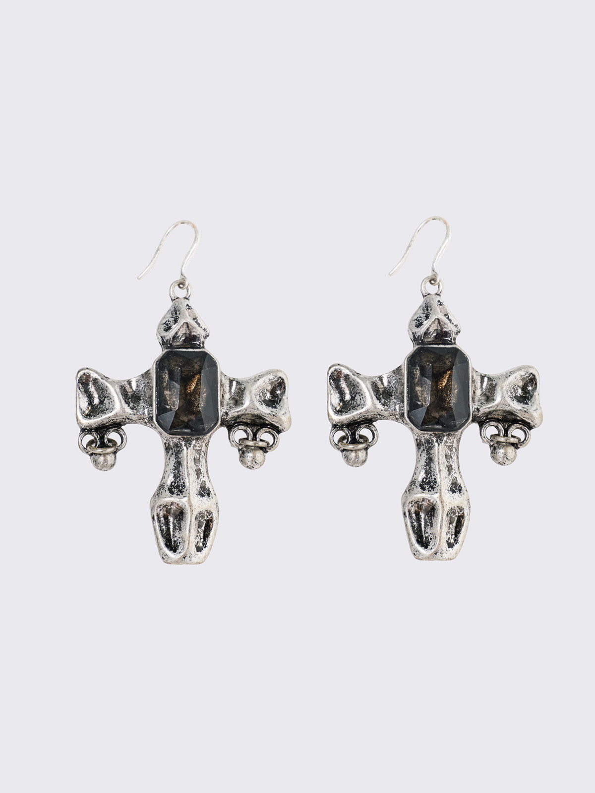 Silver dangle earrings with cross pendants featuring black stone details.