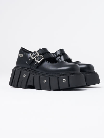 Black chunky platform Mary-Janes by Minga London. Edgy and stylish footwear with a comfortable fit. Perfect for adding a bold touch to any outfit.