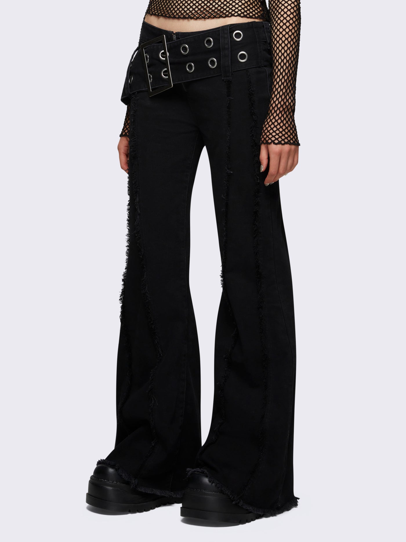 Flared jeans in black with chunky buckle belt