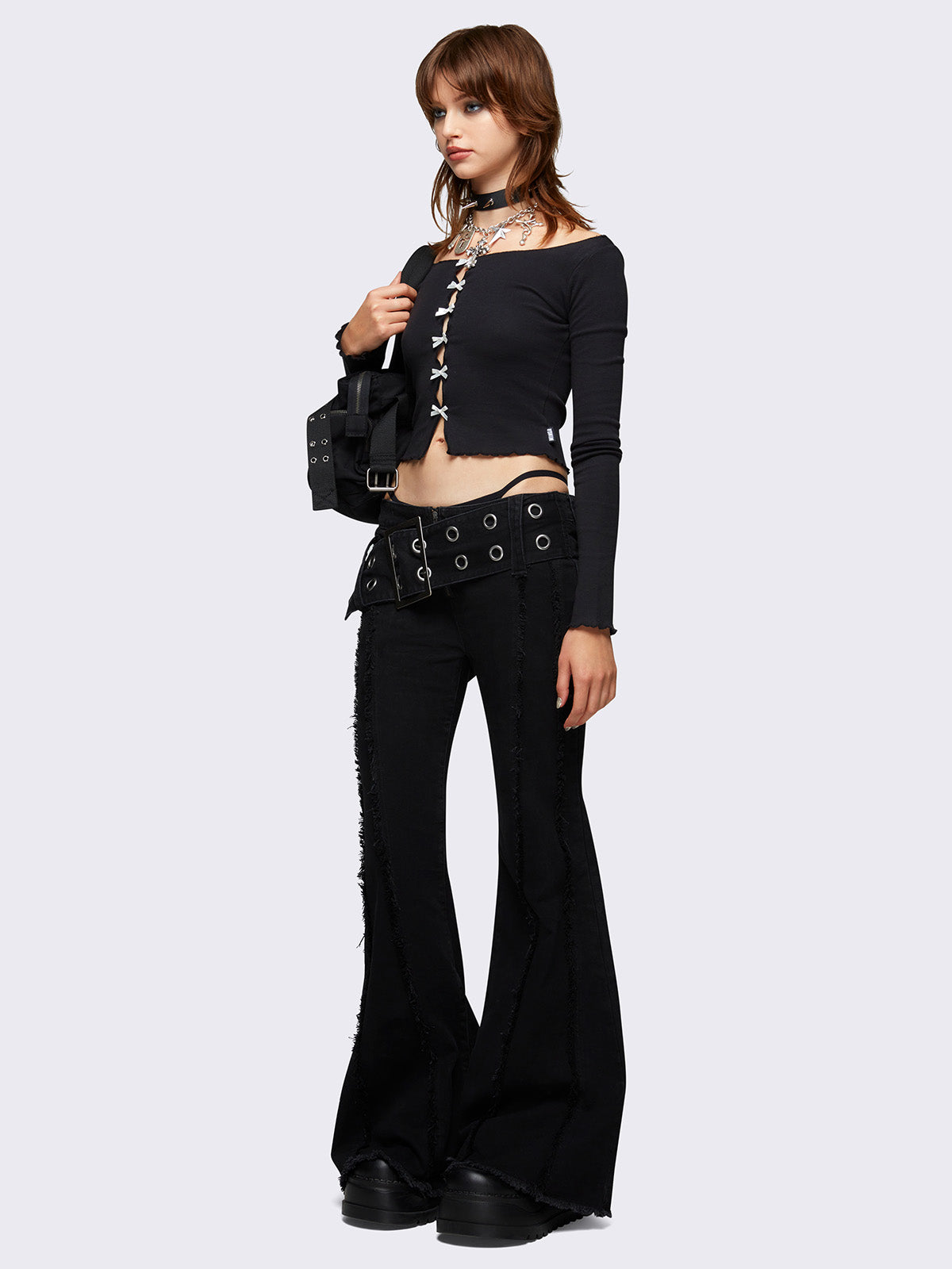 Flared jeans in black with chunky buckle belt