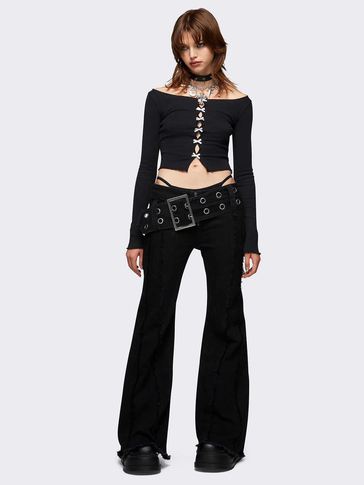 Flared jeans in black with chunky buckle belt