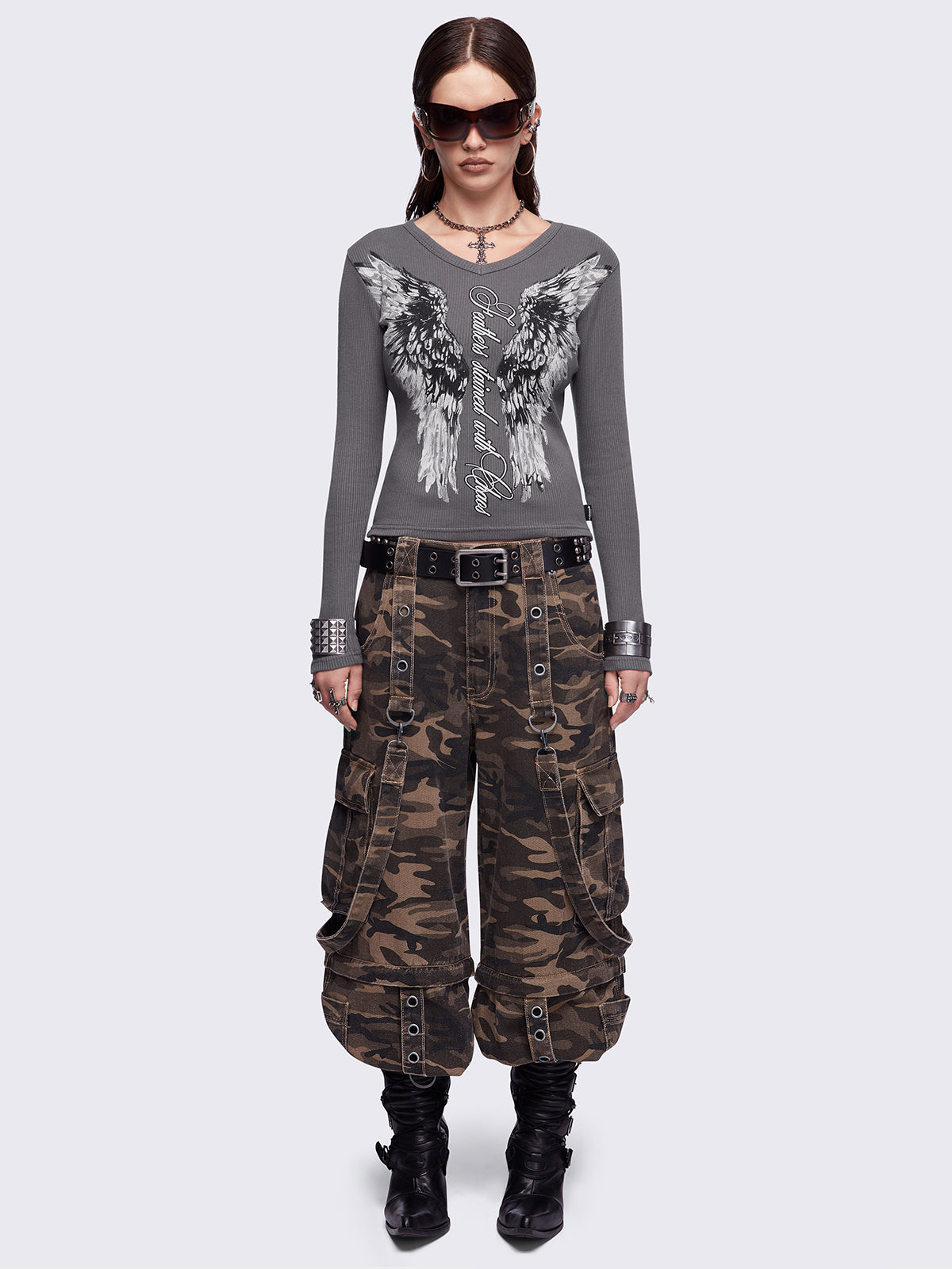 Grey long sleeve top featuring a 
"Feathers stained with chaos" wings graphic print and v-neck style.