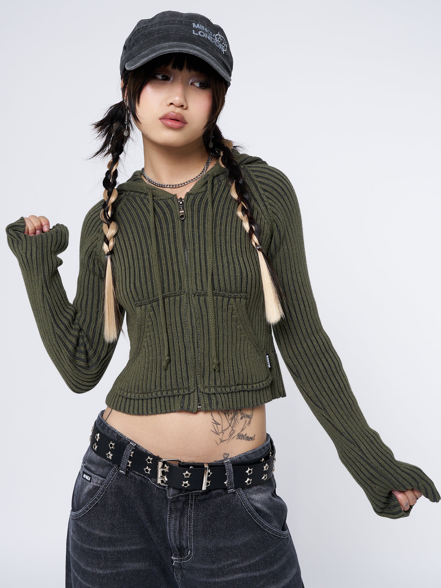 Cozy and stylish green knit cardigan with a cropped length and a hoodie design. Perfect for a trendy and comfortable look.