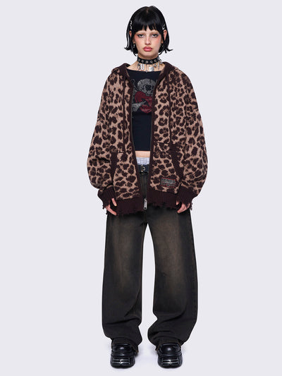 Leopard print knitted zip-up cardigan featuring a hood and distressed ribbed details for a trendy and cozy look