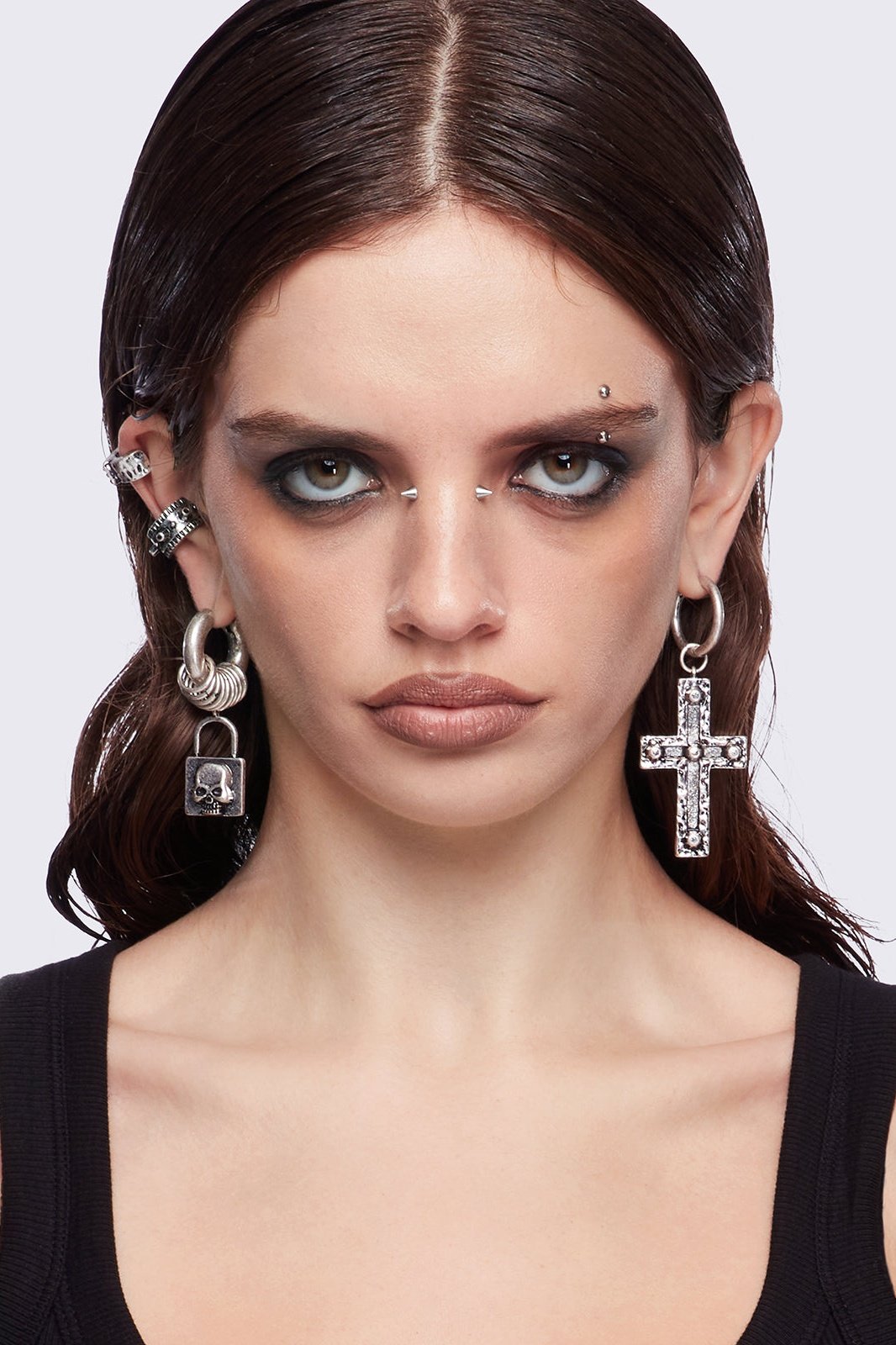 Silver 7pc earring set featuring cross pendants and more styles.