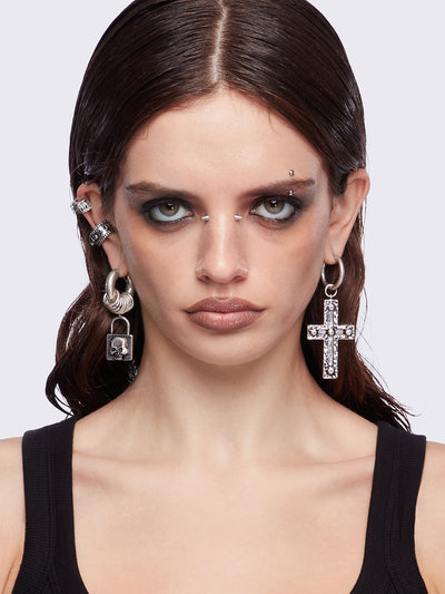 Silver 7pc earring set featuring cross pendants and more styles.