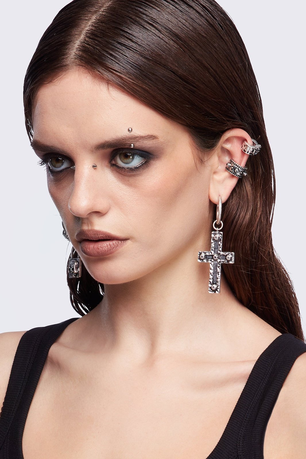 Silver 7pc earring set featuring cross pendants and more styles.