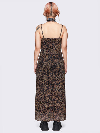 Maxi dress in leopard print featuring a lace trim neckline, adjustable cami straps and a mesh overlay. The dress is fully lined and falls to a maxi length.