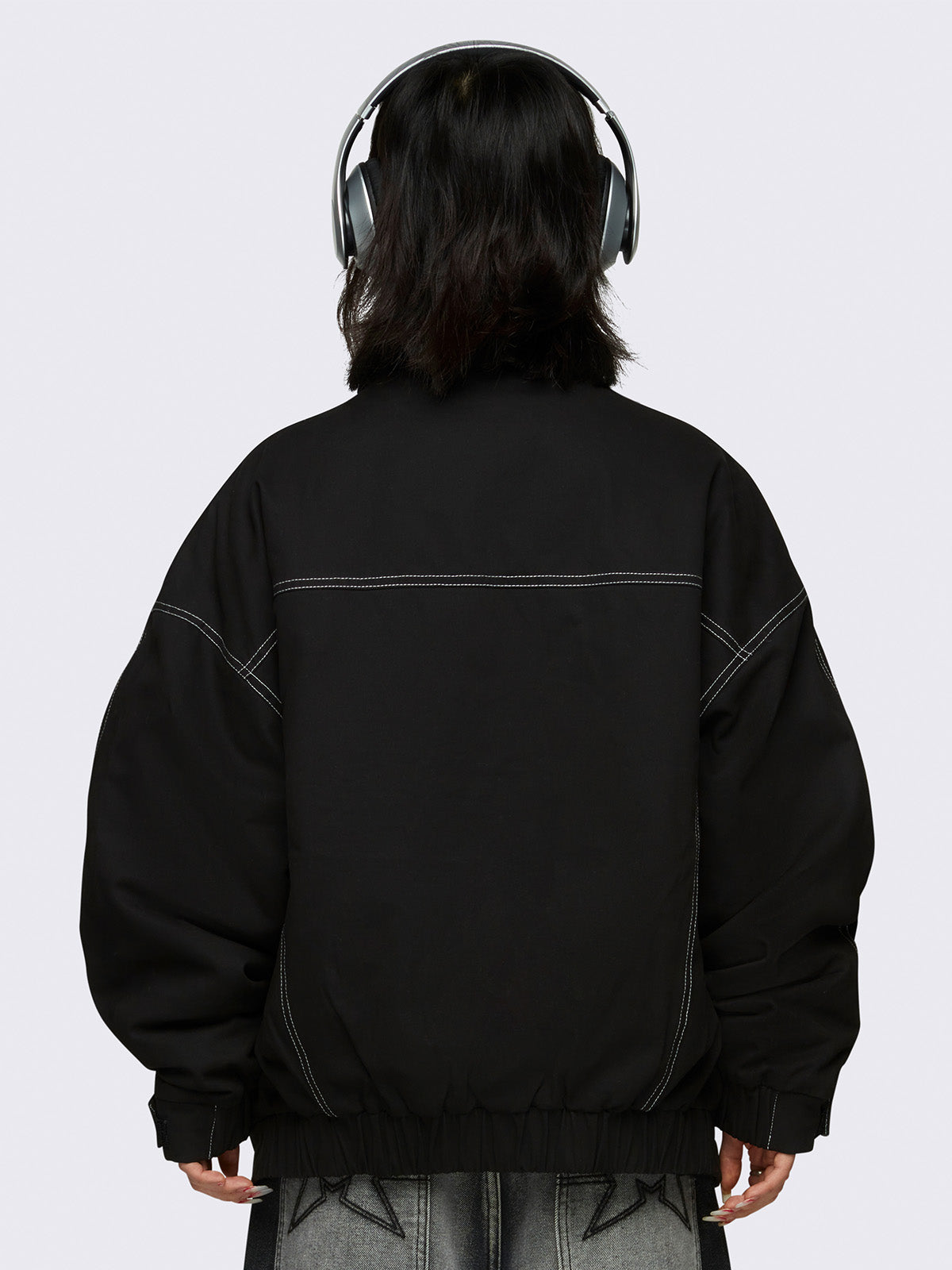 Oversized black twill bomber jacket with white contrast stitching