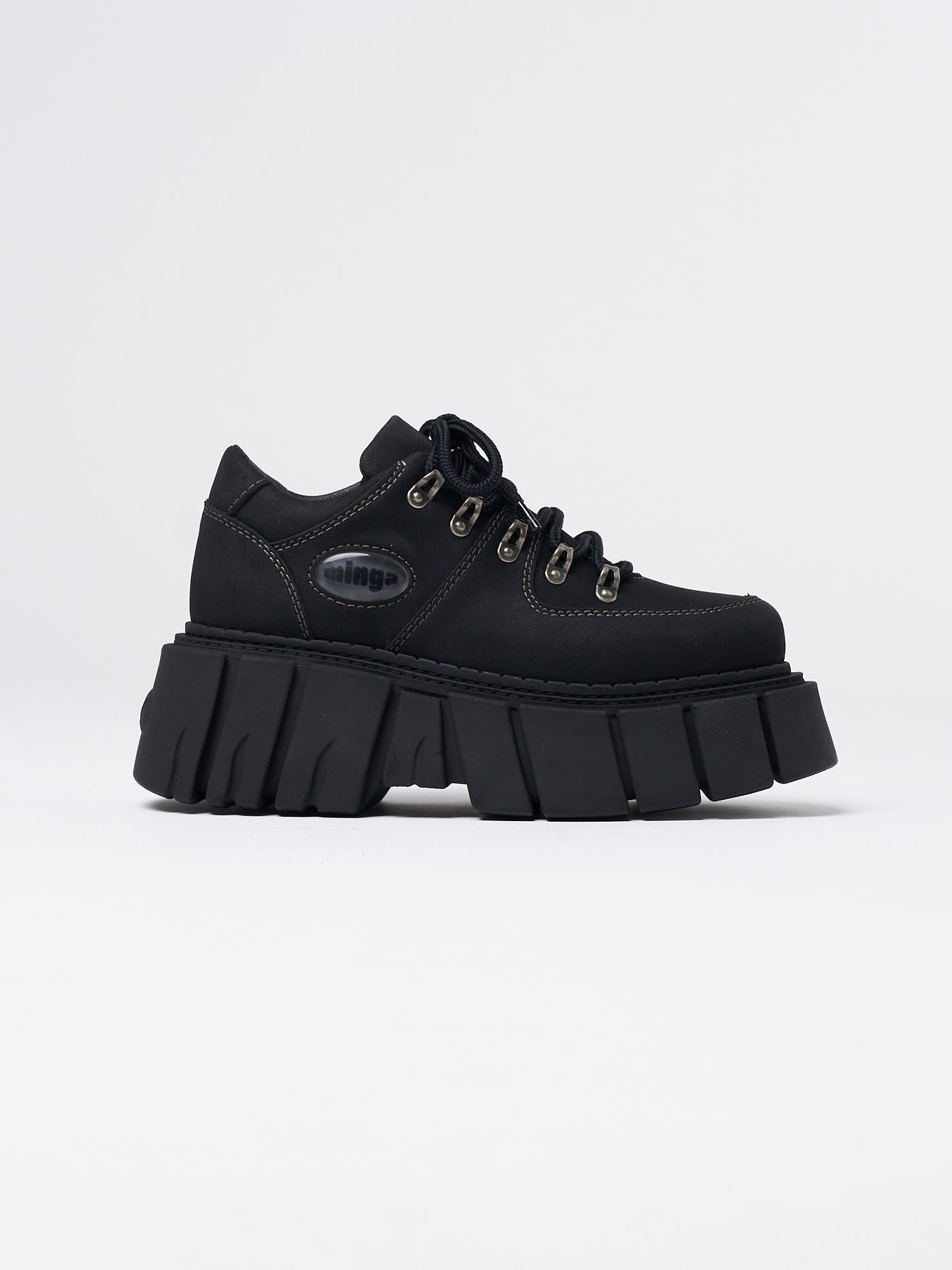 Chunky platform vegan black shoes by Minga London. Sleek, versatile, and cruelty-free footwear for effortless style and comfort.