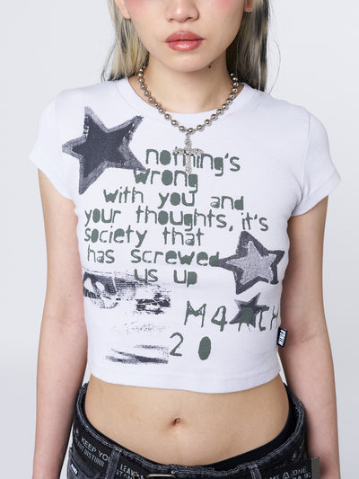 Trendy and playful baby tee with a captivating star graphic. Perfect for a stylish and youthful look.