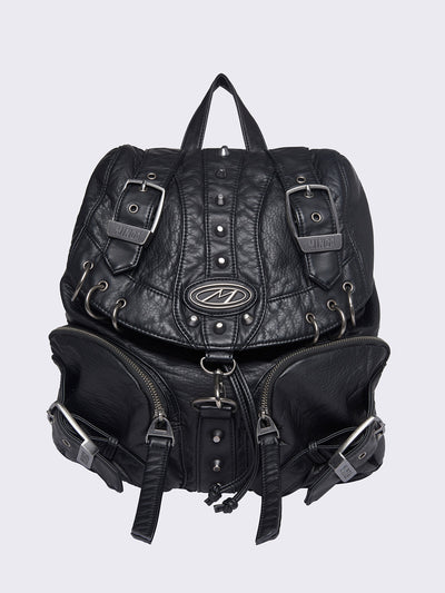 Vegan leather backpack in black with O-rings, spikes and buckles details in silver