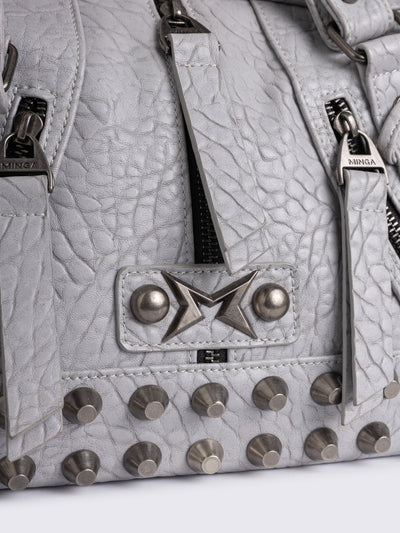 White faux leather shoulder bag with stud, lace up and metal hardware details