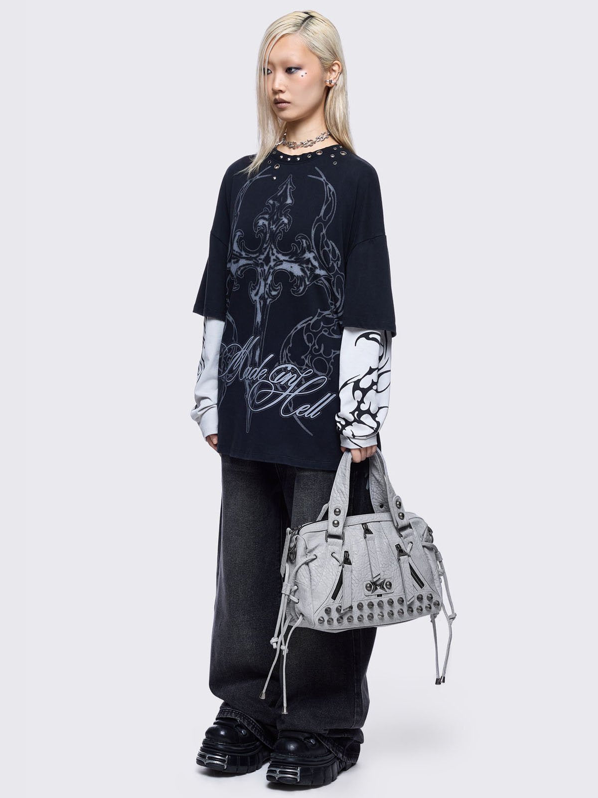 White faux leather shoulder bag with stud, lace up and metal hardware details