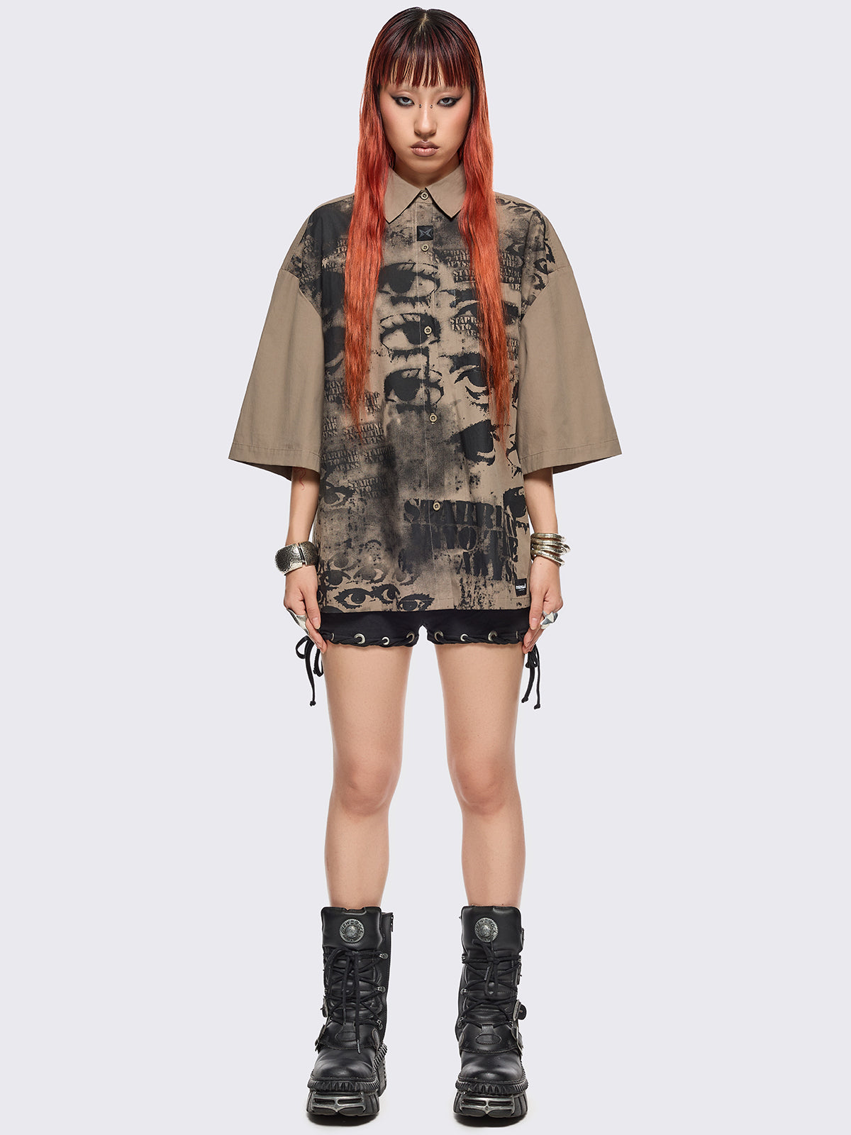 Stone short sleeve shirt featuring a black eyes and lettering graphic print, chest pocket, drop shoulders and oversize fit.