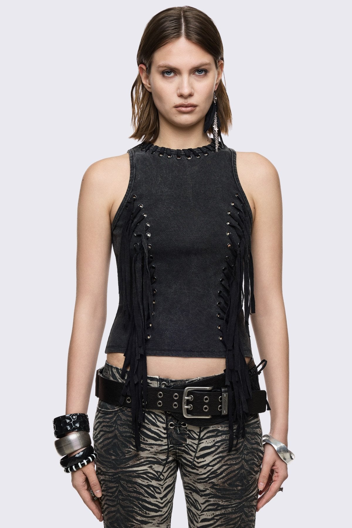 Black washed ribbed cotton tank top with lace-up eyelets and long hanging ties, slim grunge aesthetic.