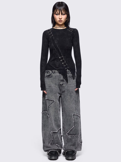 Black washed asymmetric top with cut-out and safety pin details.