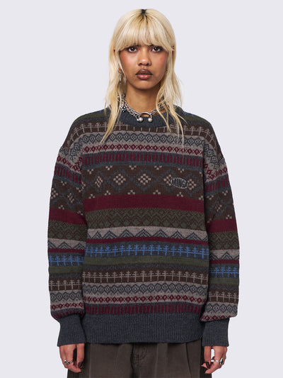 Jacquard knit jumper featuring geometric striped pattern in tones of grey, burgundy, green and blue.