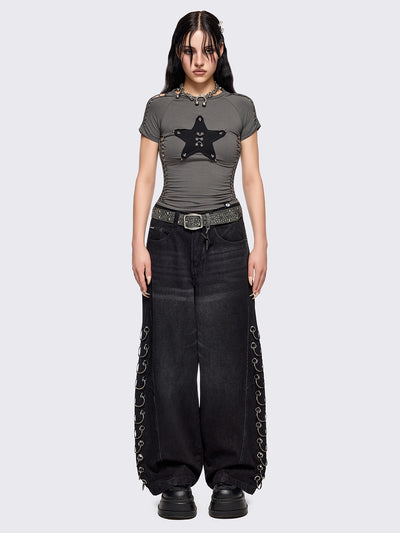 Grey slitweave baby tee with black front star patch with piercings.