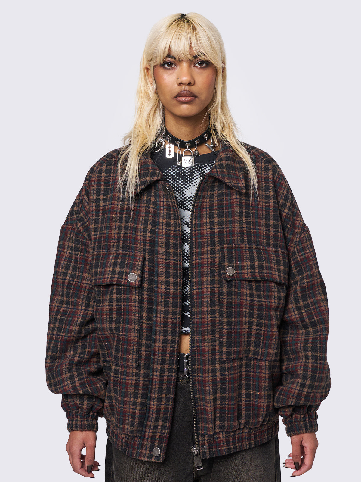 Wool bomber jacket in brown, blue and burgundy plaid pattern featuring a boxy oversize fit