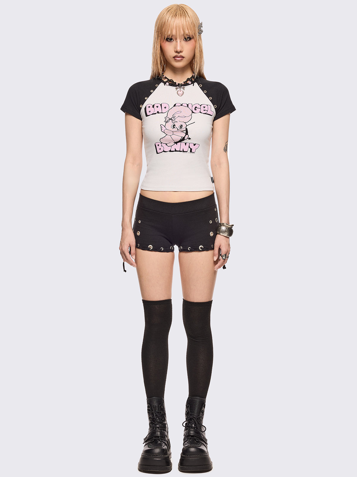 Black and white baseball tee with contrast raglan sleeves, "Bad Angel Bunny" graphic front print by Esther Bunny artist and eyelet details.
