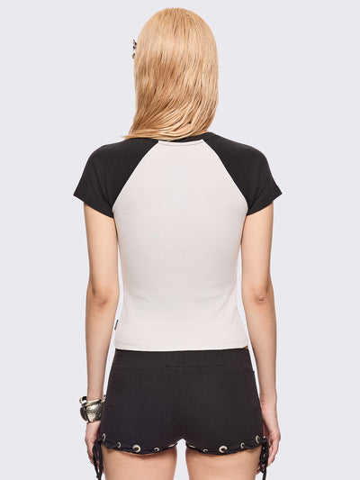 Black and white baseball tee with contrast raglan sleeves, "Bad Angel Bunny" graphic front print by Esther Bunny artist and eyelet details.