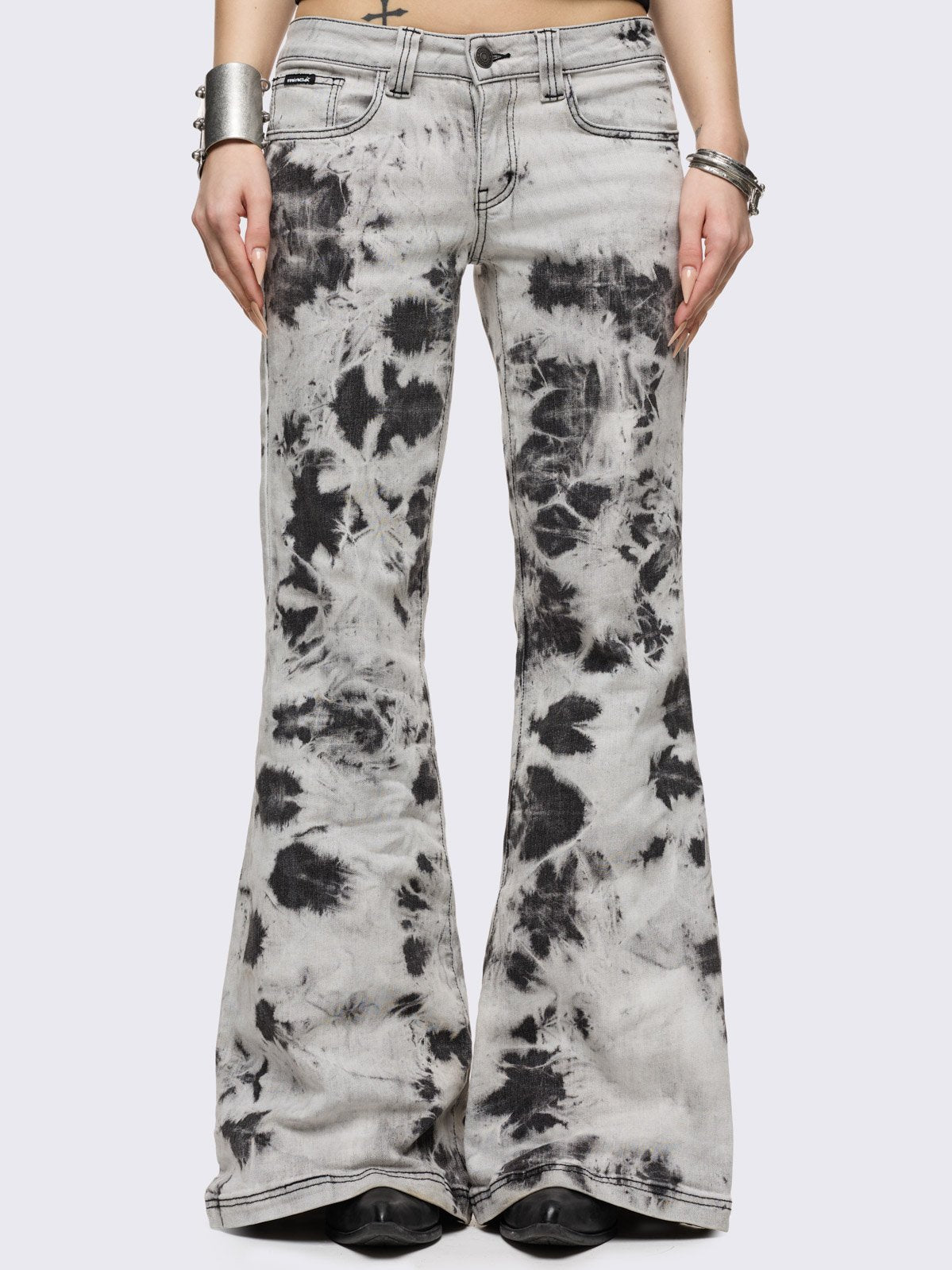 Light grey bleached tie-dye flared jeans.