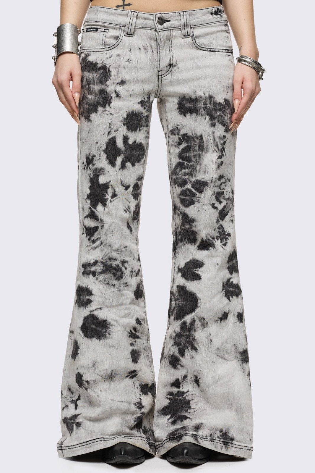 Light grey bleached tie-dye flared jeans.