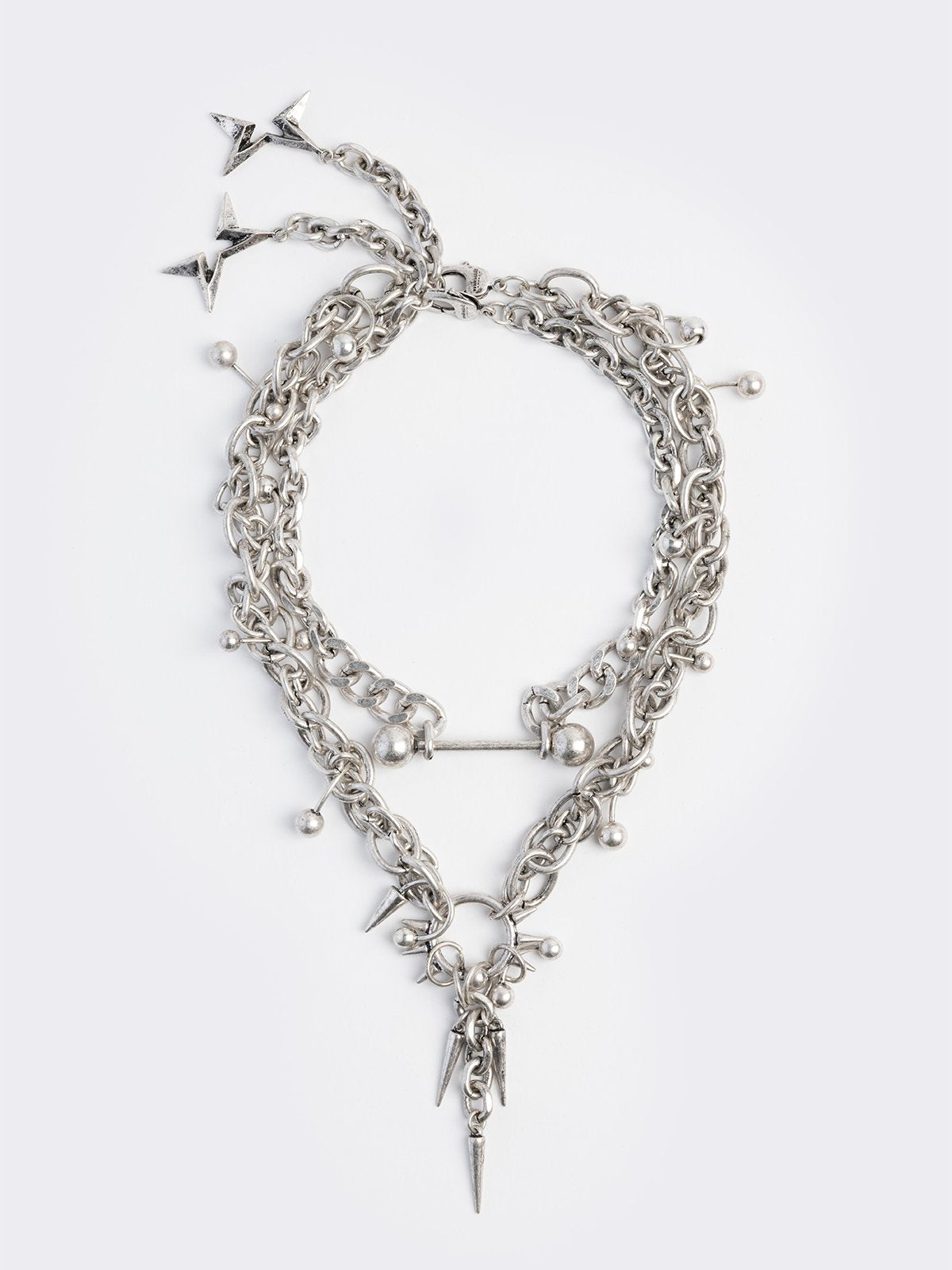 Set of 2 silver necklaces with spike and piercing details 