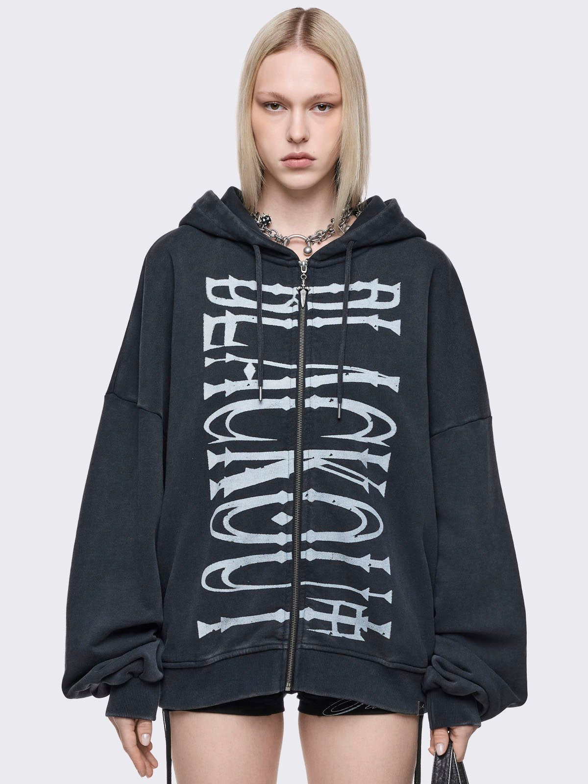 Grey washed zip up hoodie with "blackout" graphic front print in white.