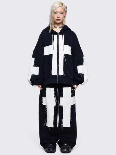 Black sweatpants with white chunky cross patches