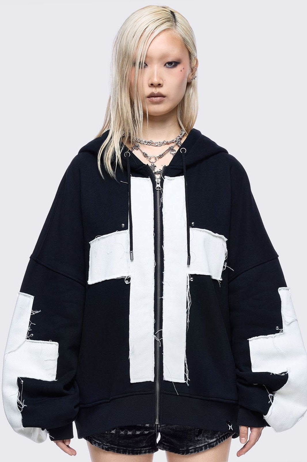 Black zip up hoodie jacket with white chunky cross patches. on front and sleeves