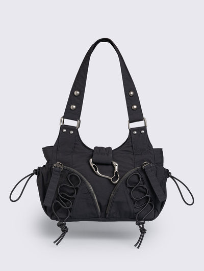 Black nylon multi pocket shoulder bag with metal hardware and lace up toggle details.