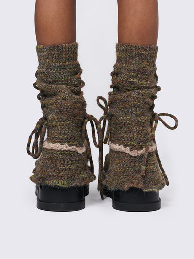 Boho crochet flared leg warmers featuring a space-dye design, lace up and ruffles details.