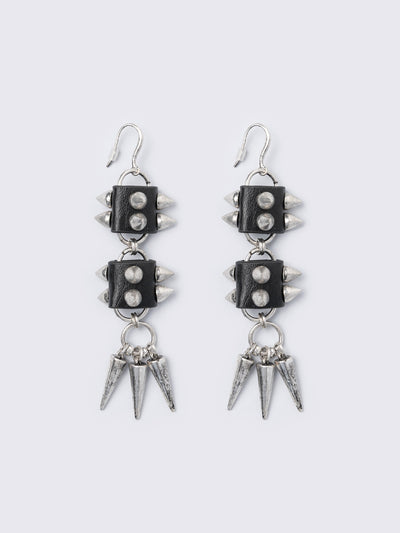 Silver dangle earrings with spiked pendants and black faux leather details