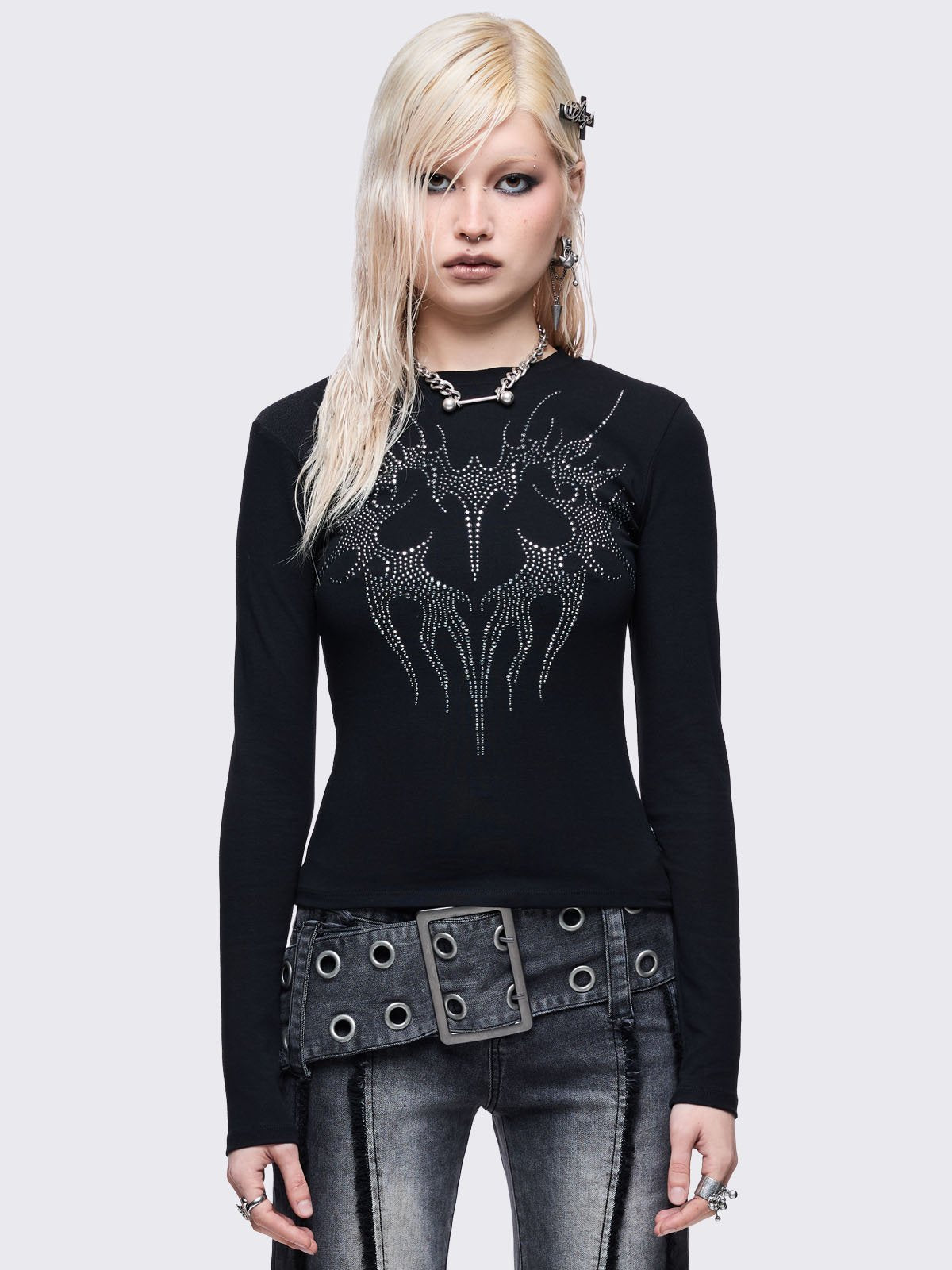 Black long sleeve top with sigilism heart rhinestone design.
