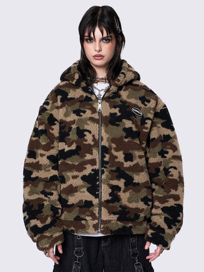 Oversized zip-up borg fleece jacket with camo print, featuring a hood, oversized fit, and embroidered logo patch. Ideal for grunge and Y2K-inspired streetwear.