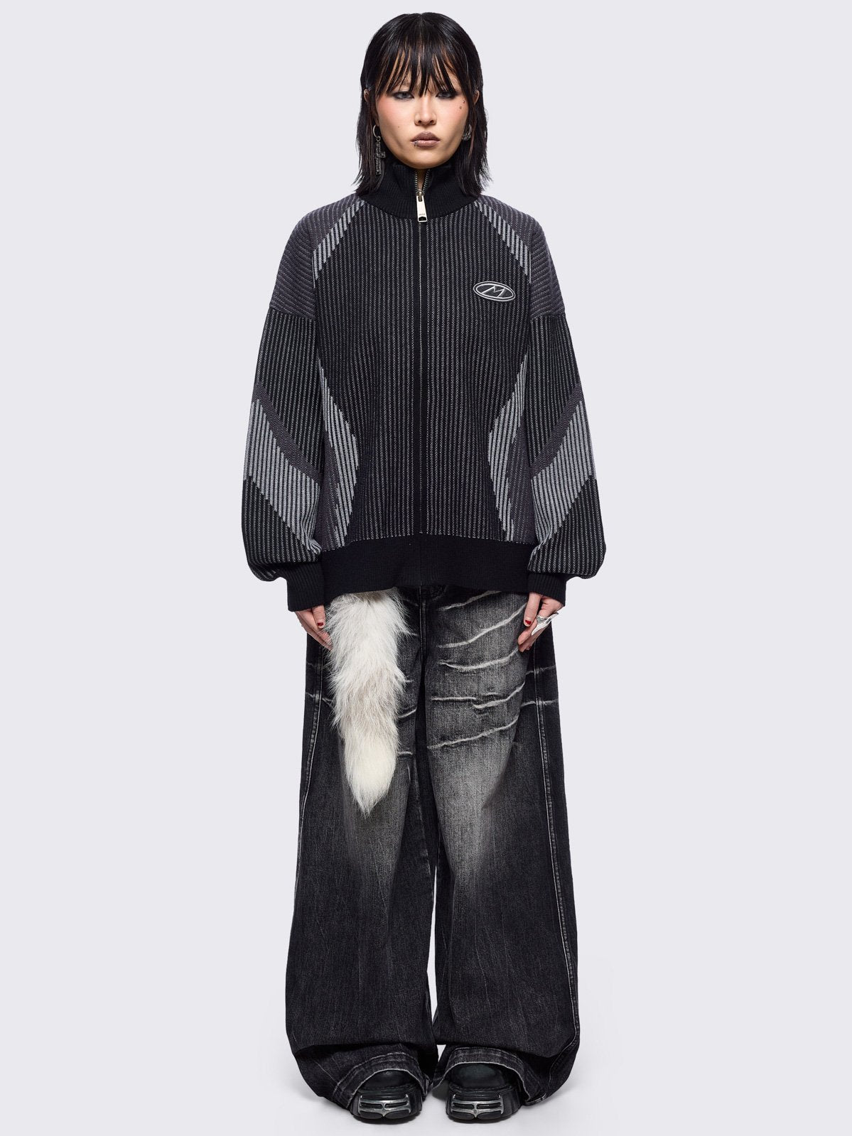 Black and grey color block knitted zip-up cardigan.