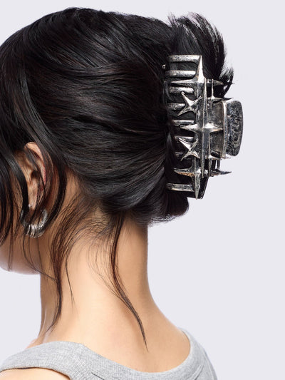 Metal hair claw clip with stars design.