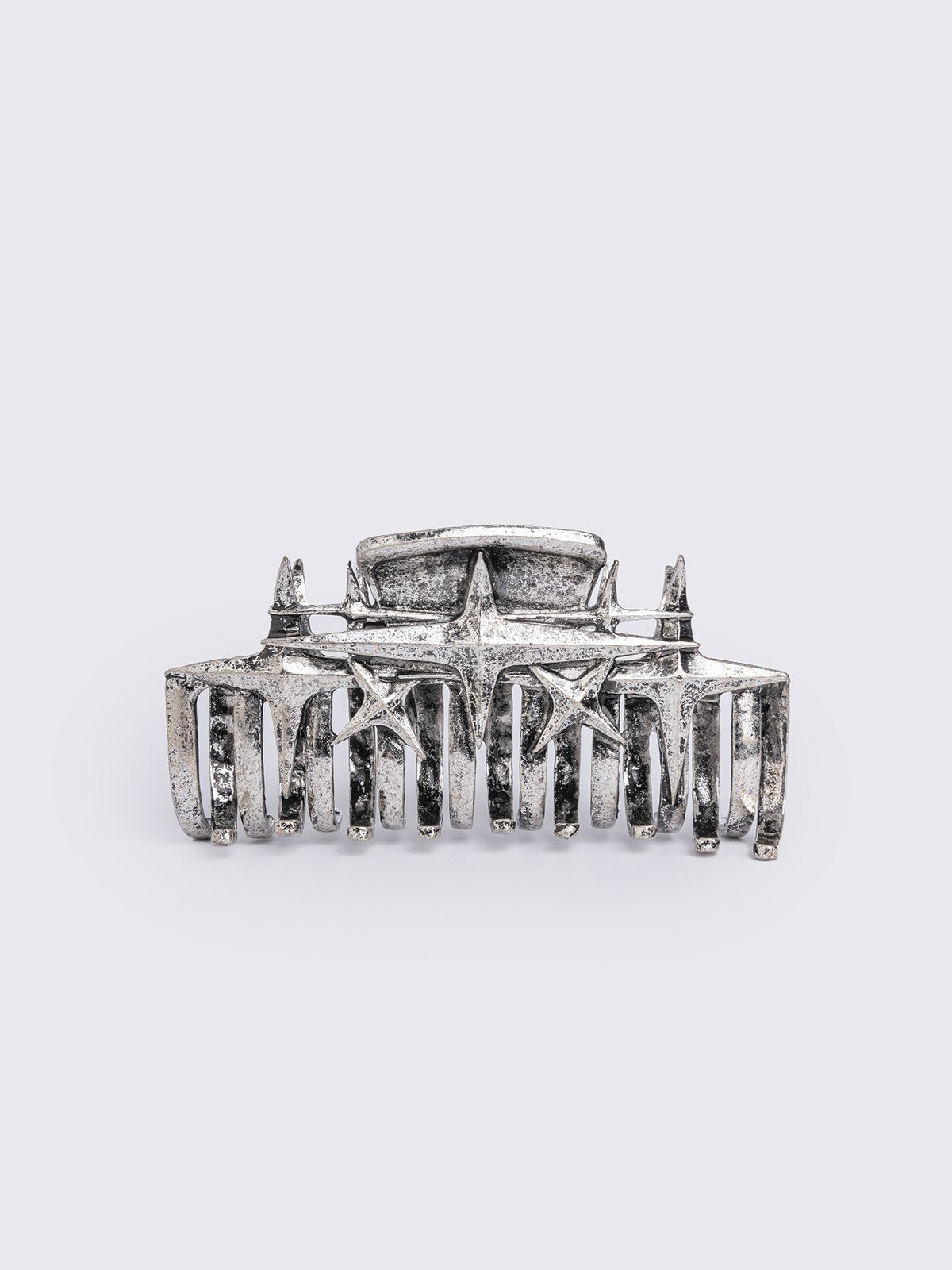 Metal hair claw clip with stars design.