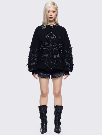 Black knitted jumper featuring frayed crosses design and stud and O-ring details.