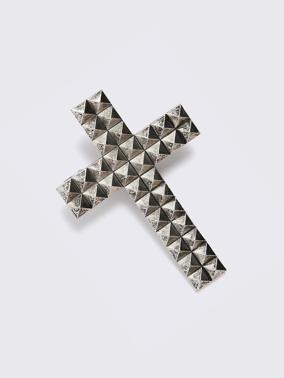 Silver crossed hair clip.