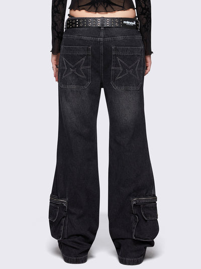 Black washed flare baggy jeans with grey overdye, twist seams, eyelet details and utility ankle pockets.