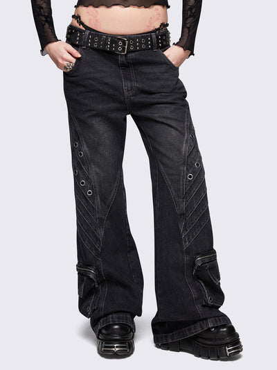 Black washed flare baggy jeans with grey overdye, twist seams, eyelet details and utility ankle pockets.